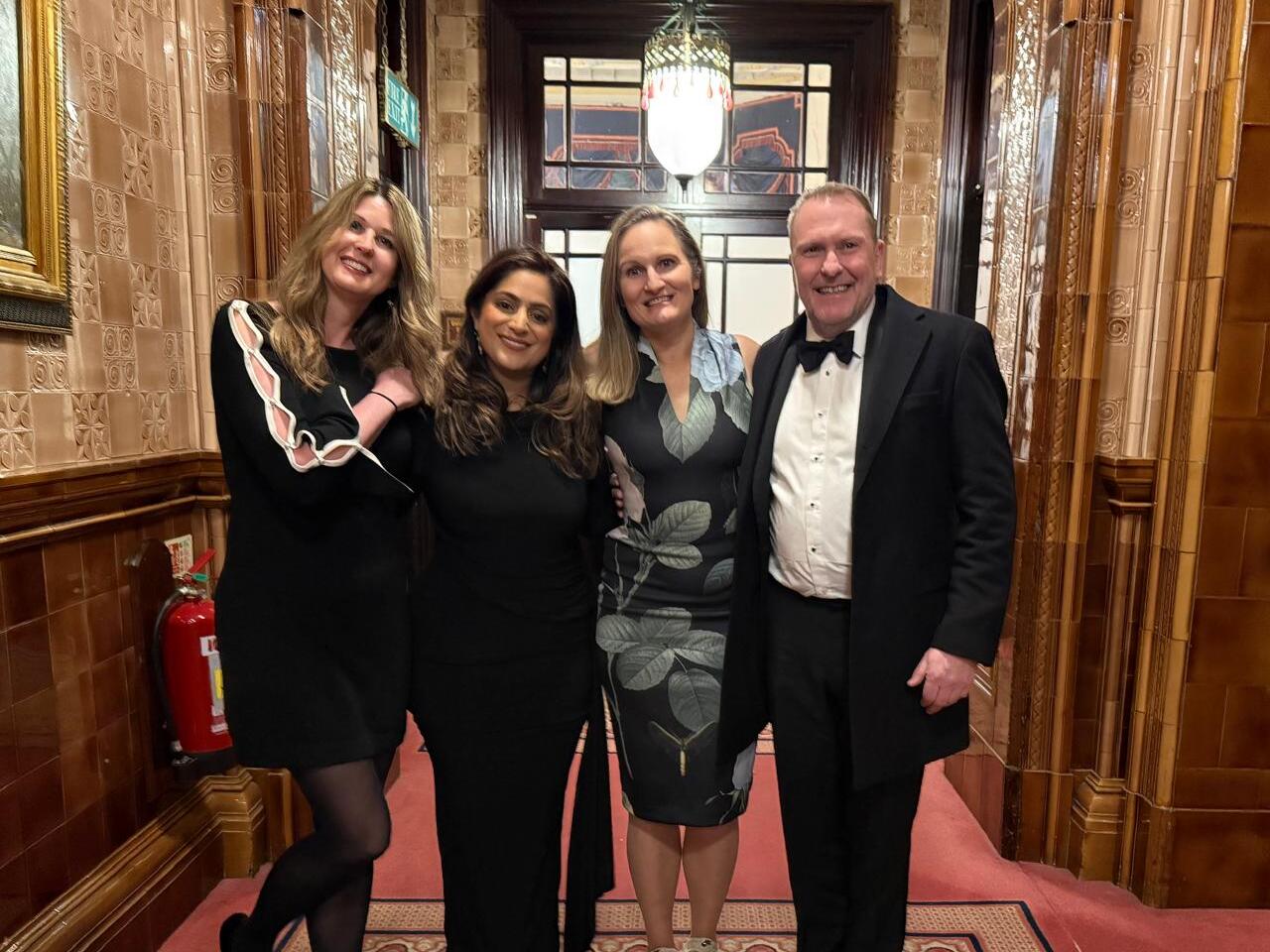 The Qomply team celebrating their win at FOW Awards 2025
